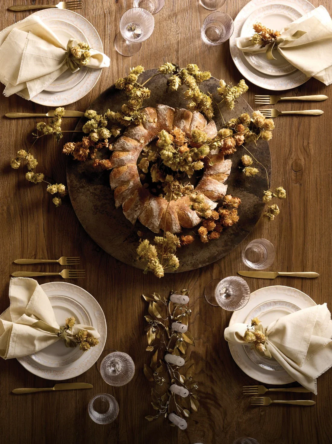 Holiday center piece and table top on a warm wood dining table