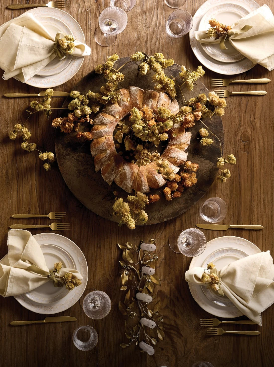 Holiday center piece and table top on a warm wood dining table