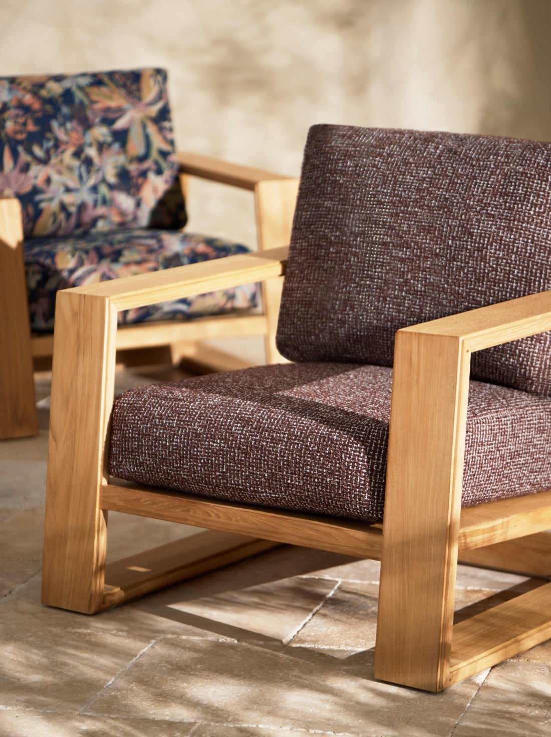 Best-selling outdoor furniture with cushioned seating, natural materials, and layered textures in a relaxed open-air setting.